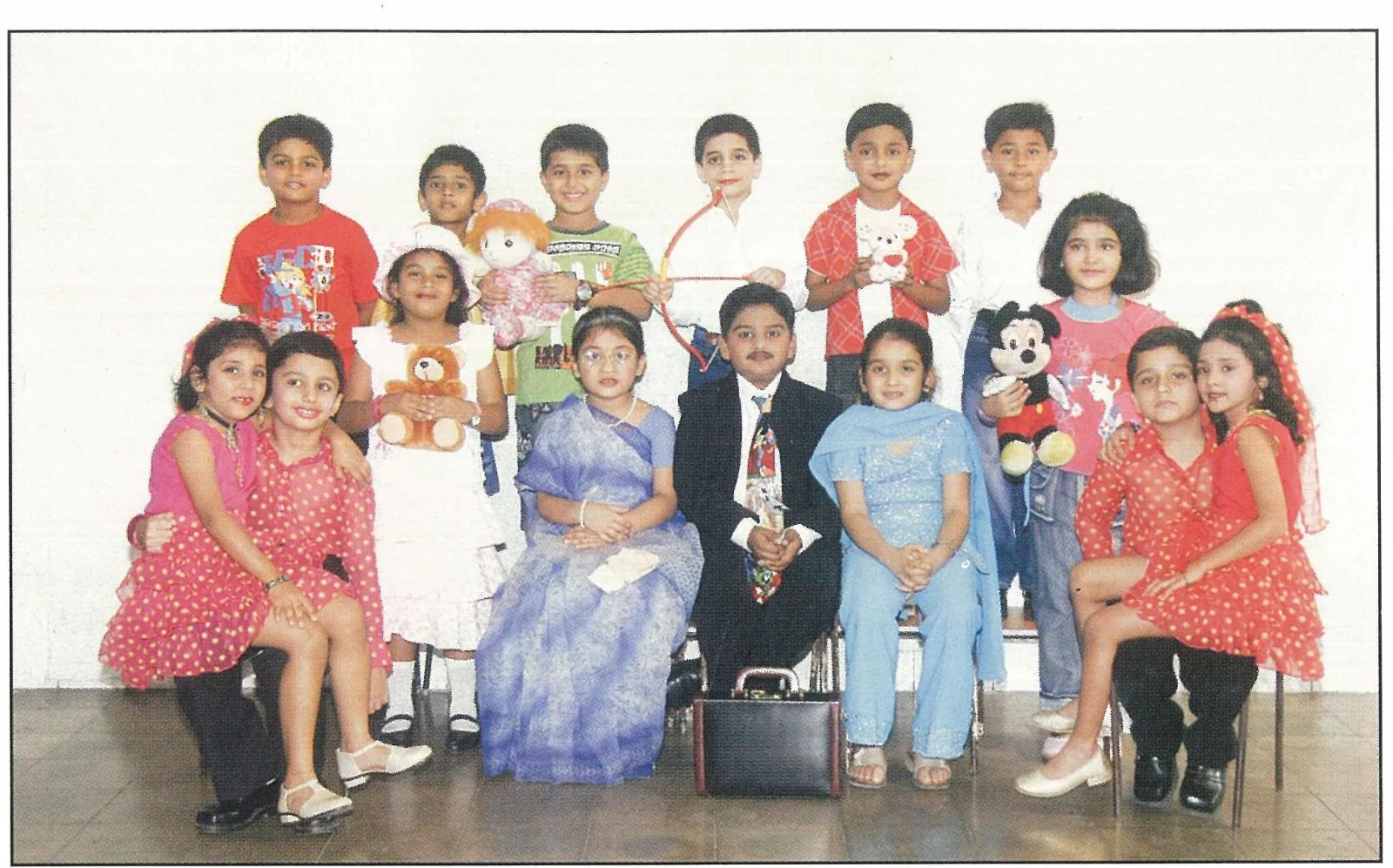 Children posed as different classroom characters in costume